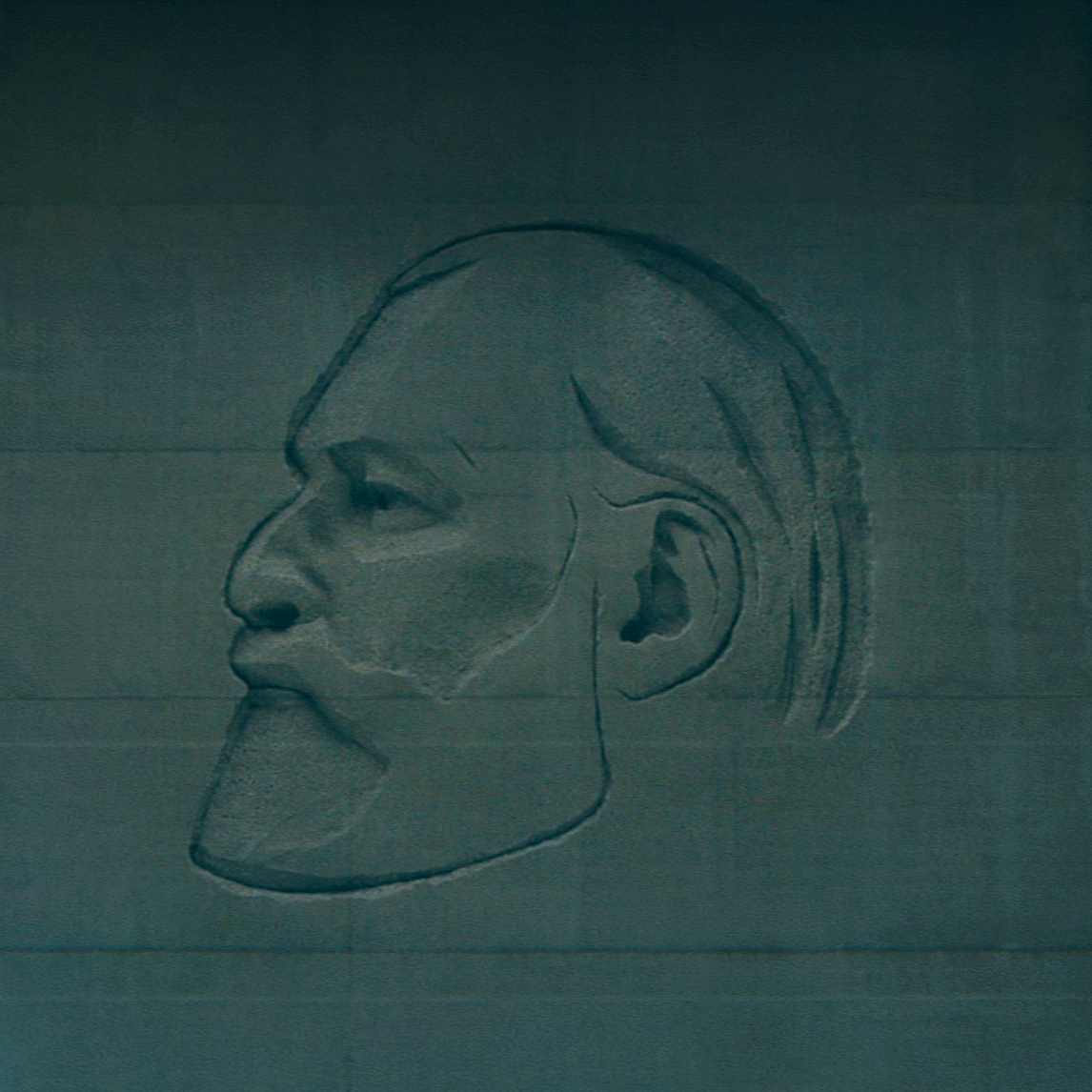 A bust of Kier Eagan in relief, displayed in the Lumon Industries lobby